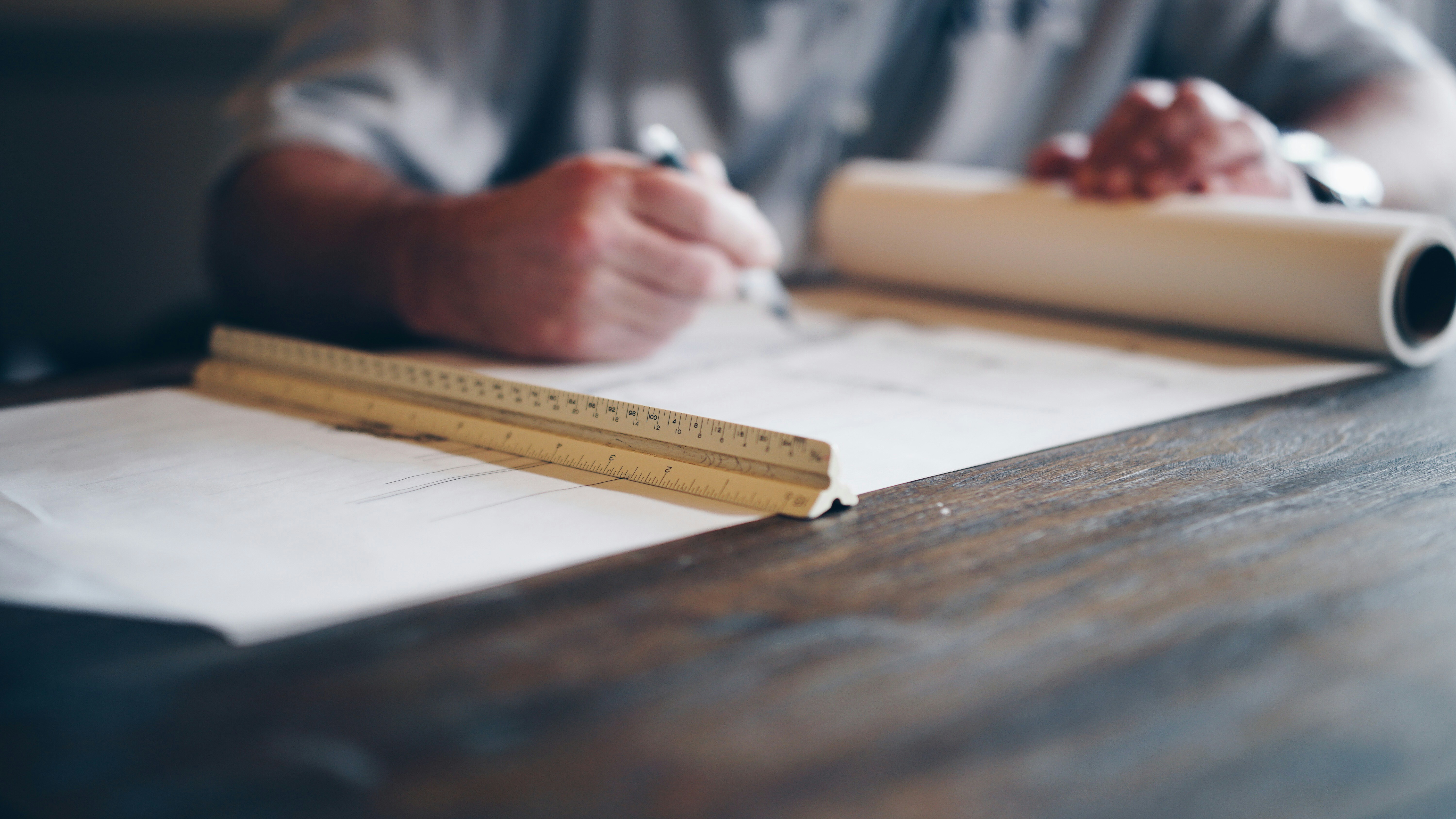 man working on the map of his house - cash out refinance construction loan