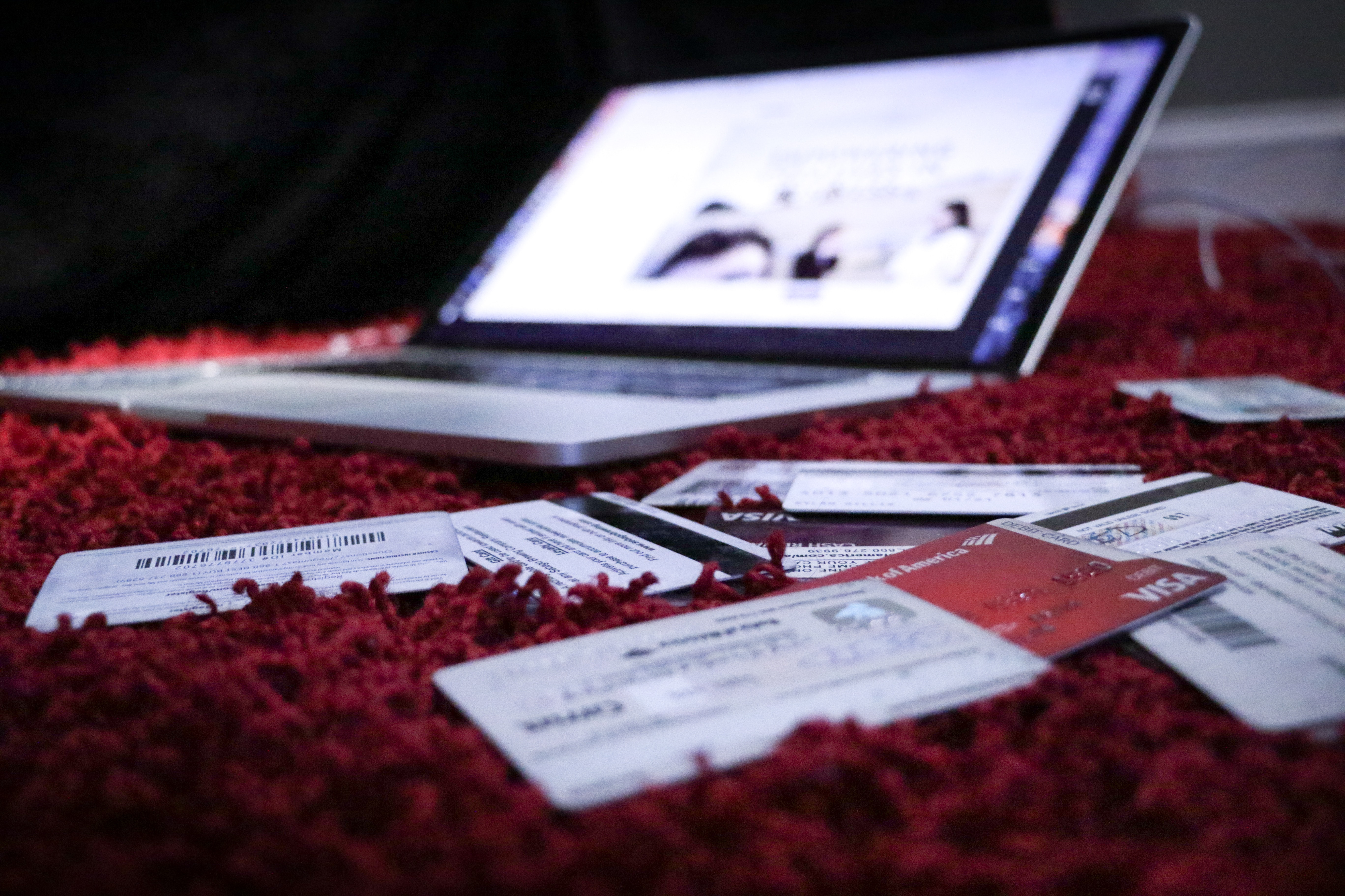 credits cards infront of laptop - foreclosure refinance
