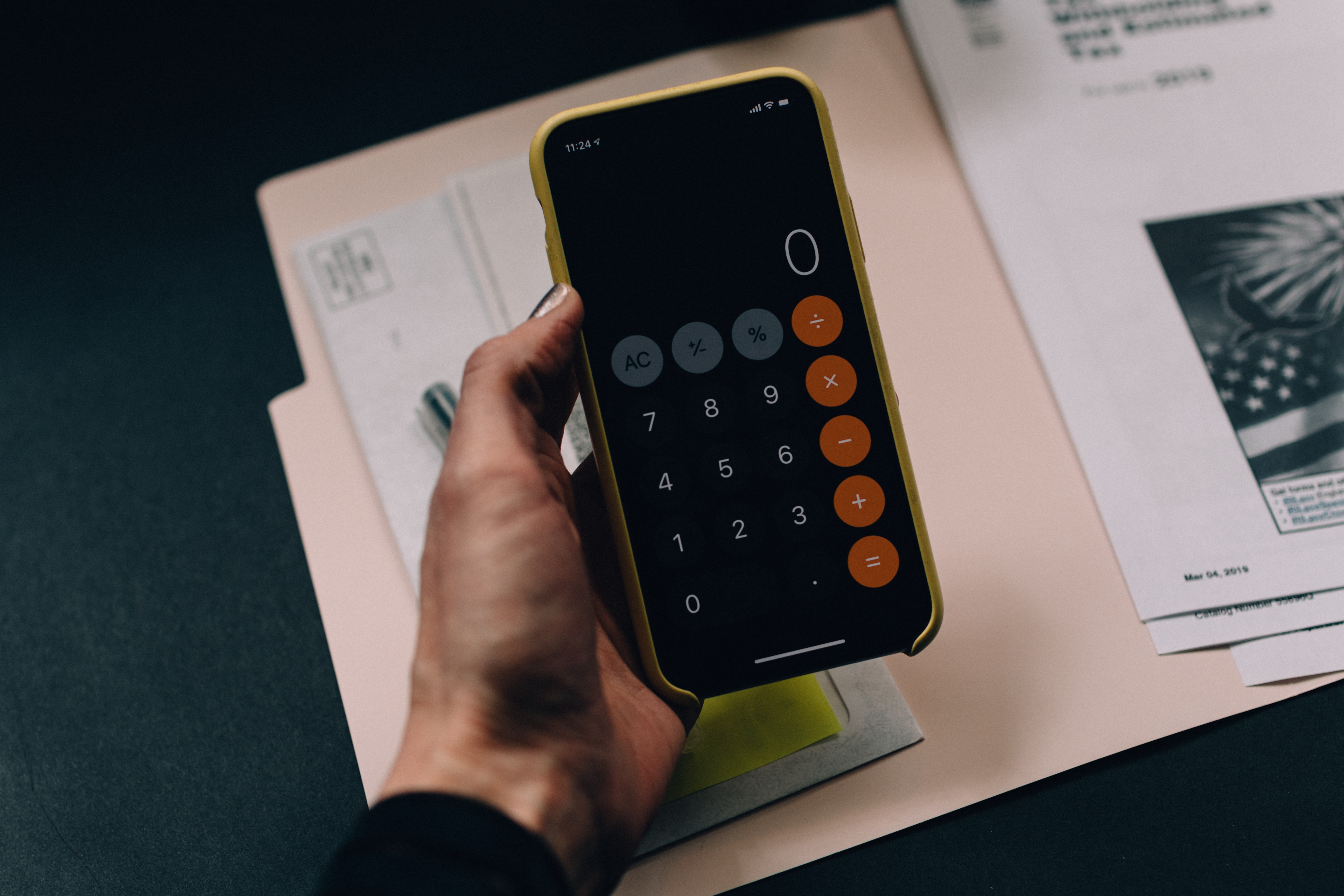 man making calculations on iphone - can i refinance a private mortgage