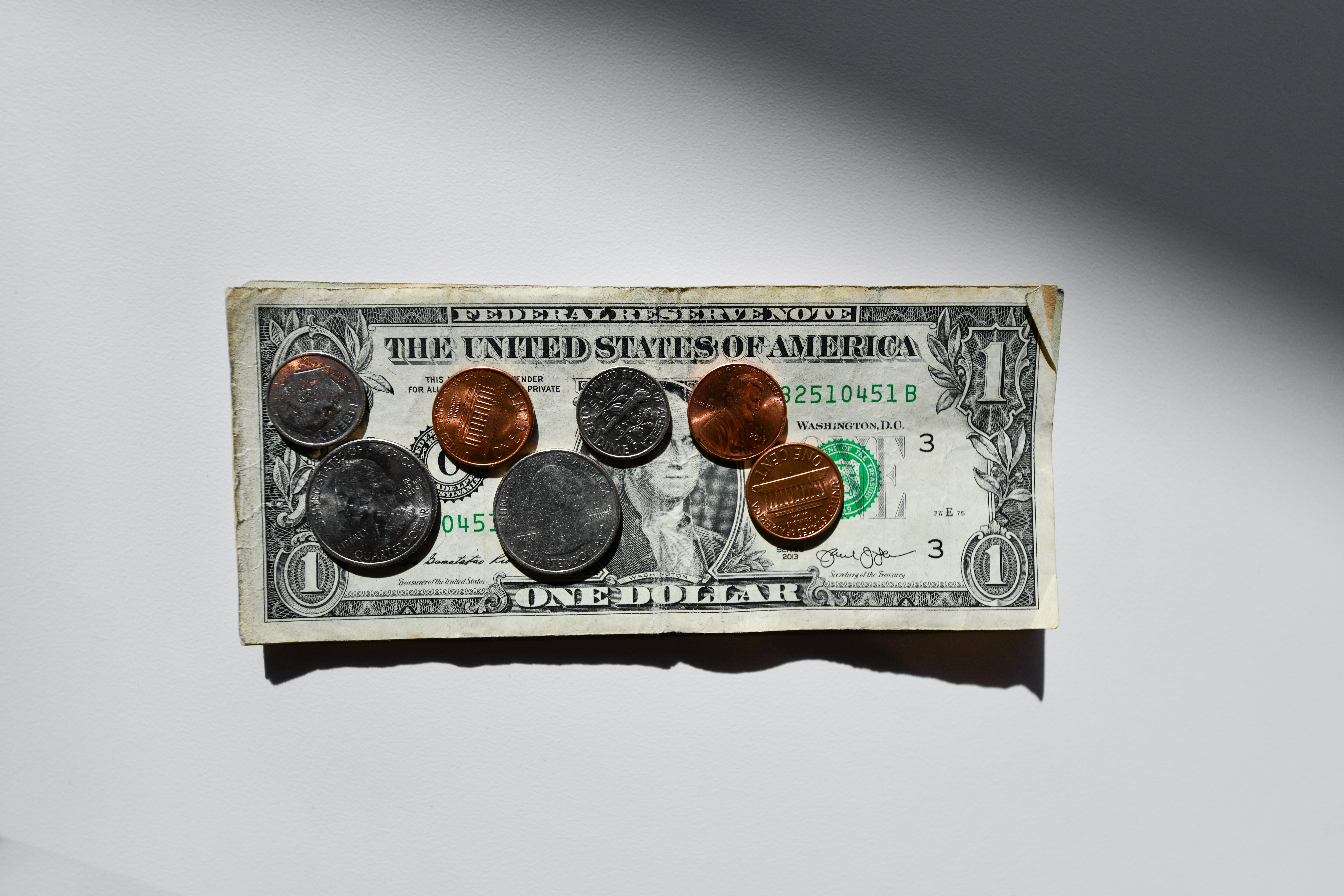 dollar with some cents on it - foreclosure refinance