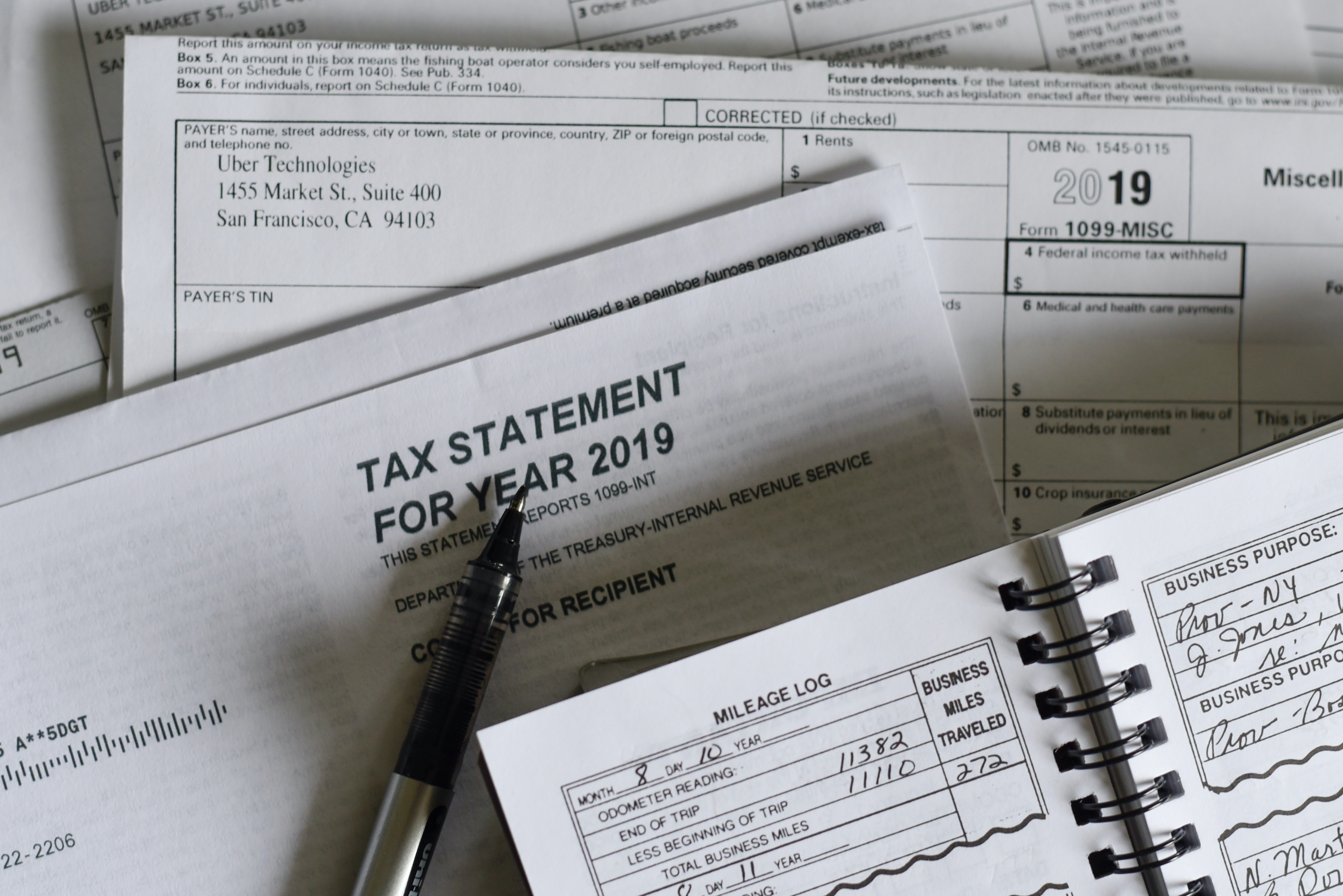 tax statement documents on table - foreclosure refinance