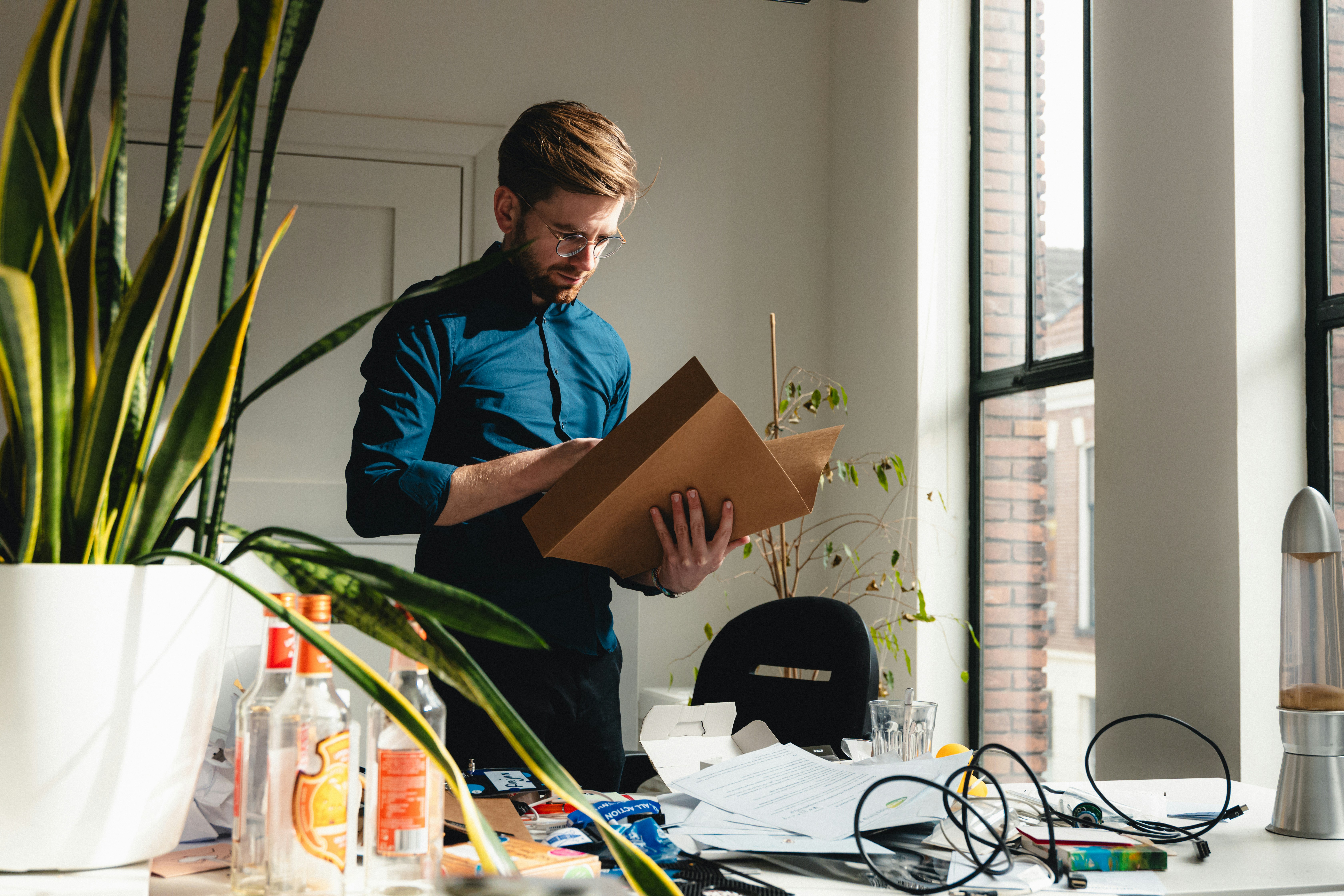 man looking through his files on refinancing mortgage while in chapter 13