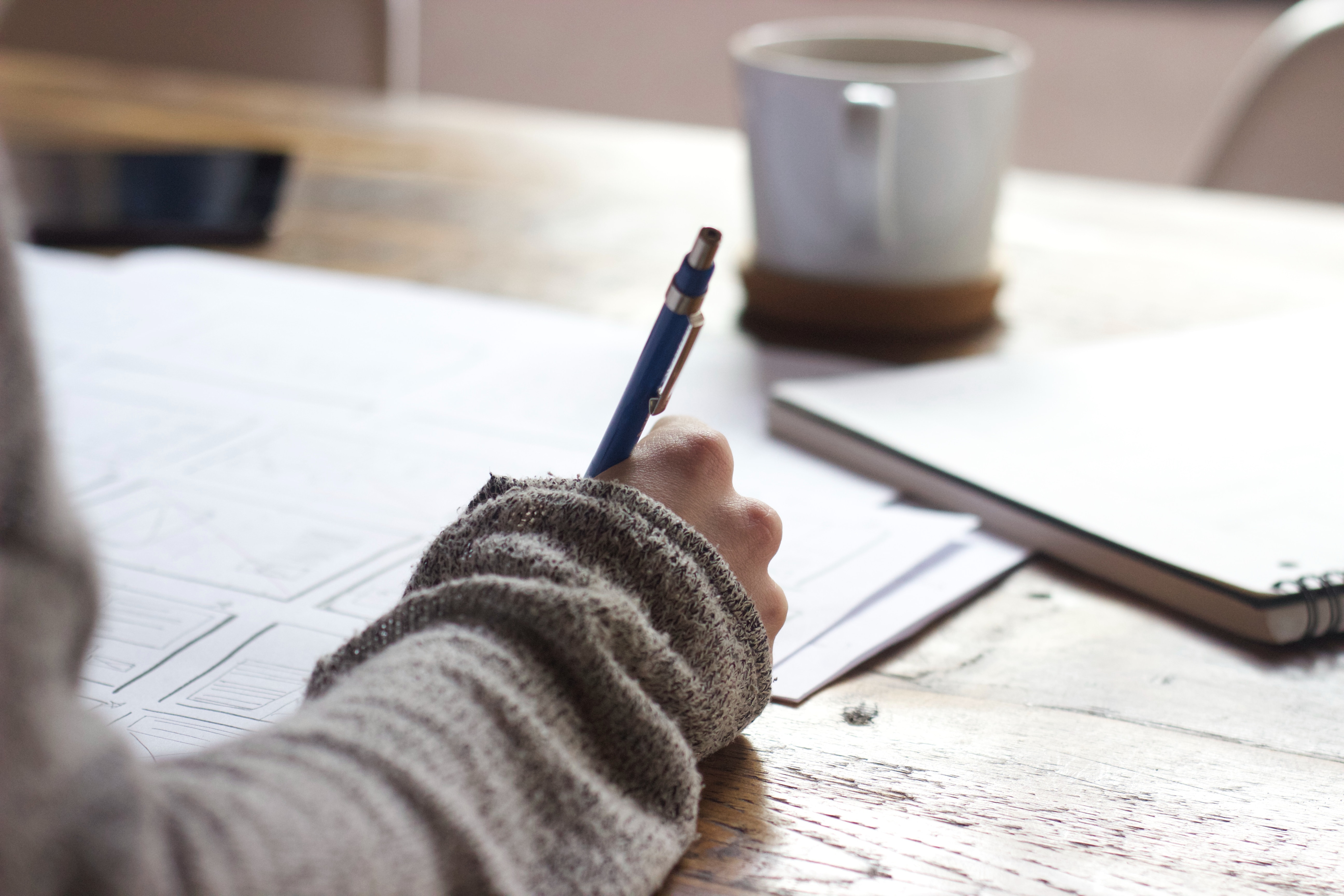 Woman signing documents - foreclosure refinance