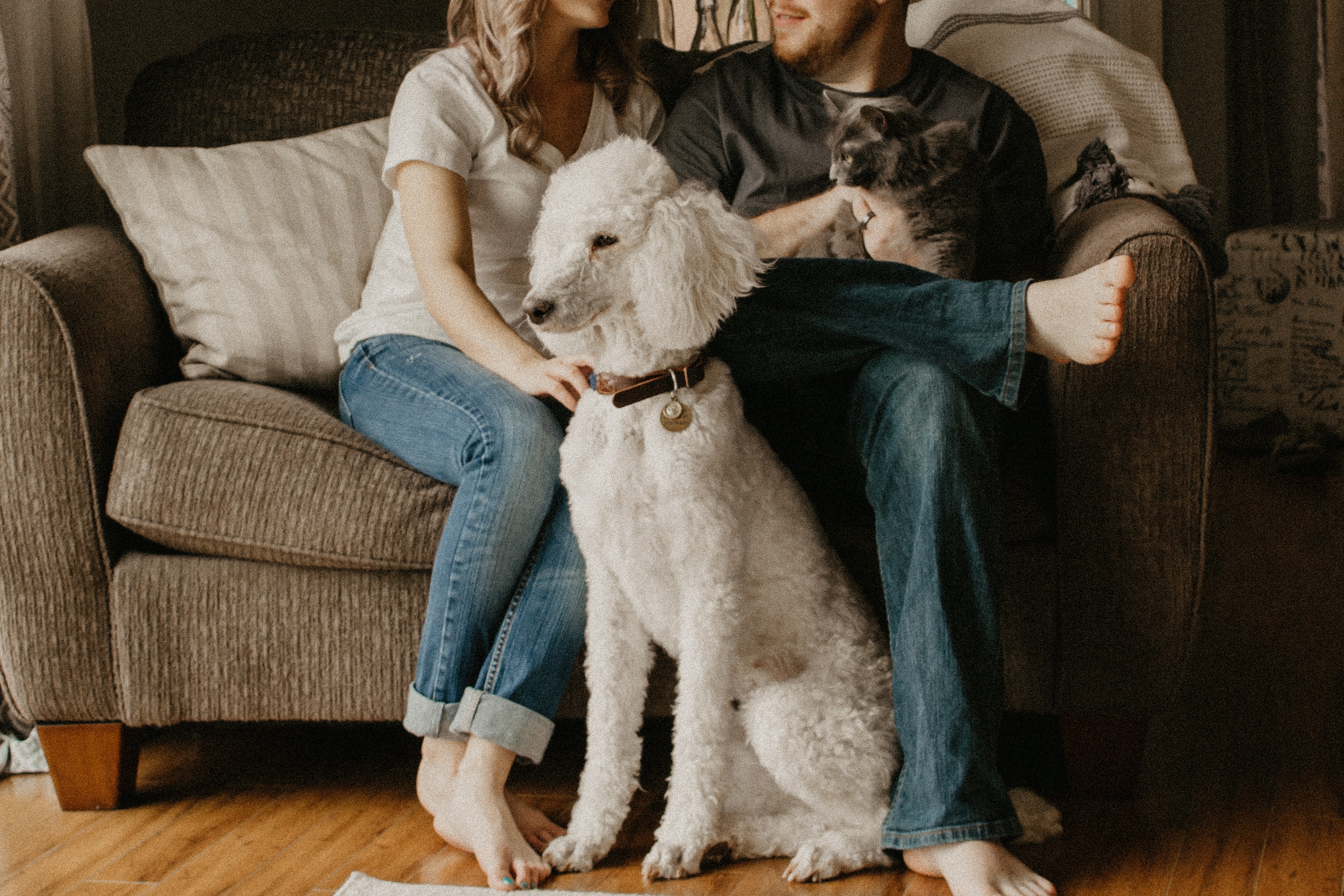 family sitting in their home - foreclosure refinance